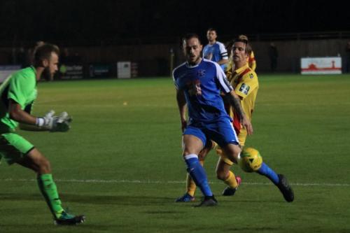 Tonbridges Arthur Lee (blue) shields the ball from Sam Youngs