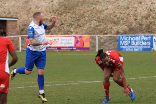 Enfields Billy Bricknell heads wide as Yannis Ambroisine (R) makes sure he doesnt inadvertently deflecty the ball goalwards