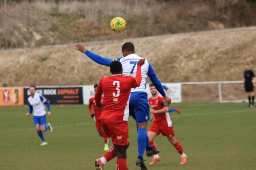 Enfields James Mulley (7) and Whitehawks Aaron Goode
