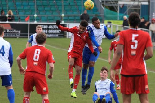 Enfields James Mulley (white) challenges Ky Marsh-Brown