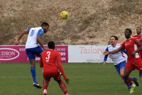 Enfields Kezie Ibe (10) heads on goal but too close to the keeper