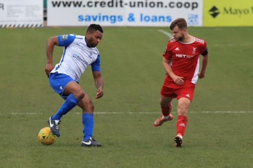 Enfields Kezie Ibe (L) and Whitehawks Henry Muggeridge
