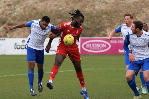 Enfields Kezie Ibe (L) challenges Yannis Ambroisine