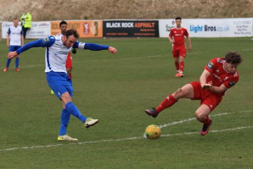 Enfields Matt Johnson shoots as John Paul Kissock tries to block