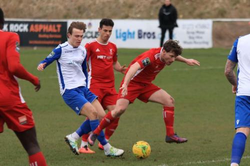 Enfields Mickey Parcell and Whitehawks John Paul Kissock (R) and Lucas Rodrigues