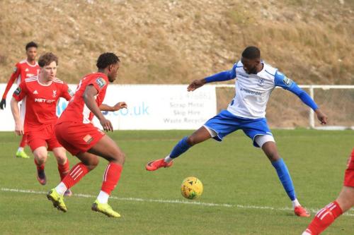 Enfields Muhammadu Faal and Whitehawks John Paul Kissock (L) and SinnKaye Christie
