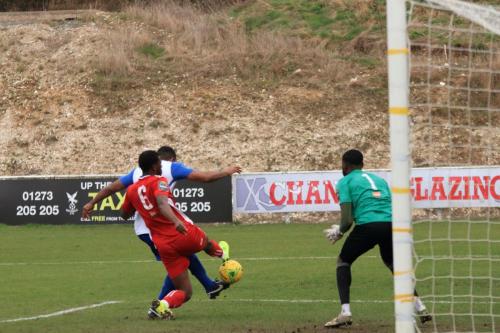 Kezie Ibe (white) puts Enfield ahead in the second minute