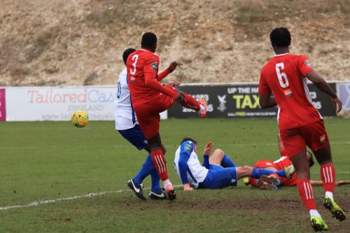 Whitehawks Aaron Goode (3) clears