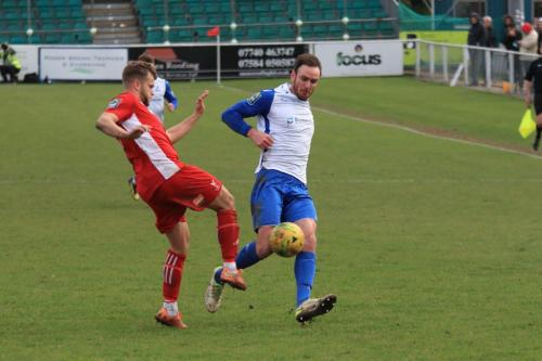 Whitehawks Henry Muggeridge (L) and Enfields Matt Johnson