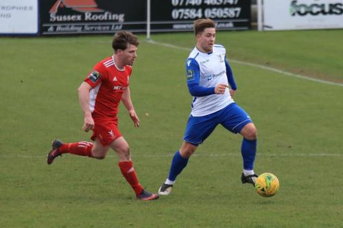 Whitehawks John Paul Kissock (L) and Enfields Lewis Taaffe