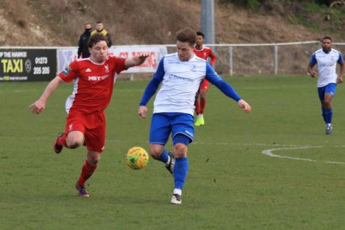 Whitehawks John Paul Kissock (L) and Enfields Lewis Taaffex
