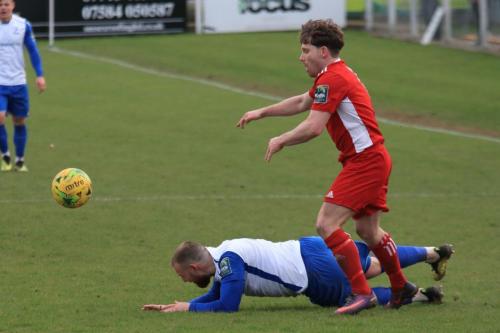 Whitehawks John Paul Kissock (red) and Enfields Billy Bricknell