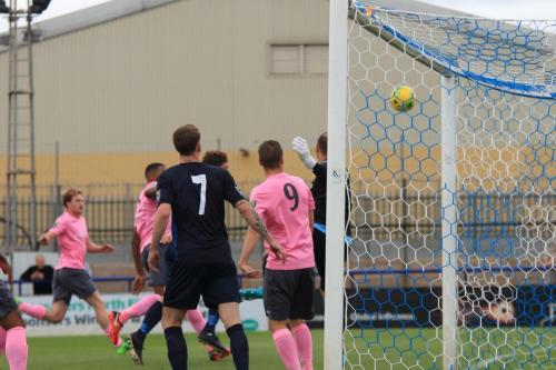 Anxious looks as a corner curls just wide of the Wingate goal