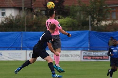 Enfields Brandon Adams (pink) challenges Marc Weatherstone