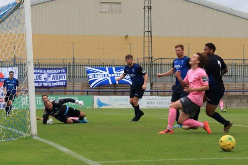 Enfields Sam Chaney (pink)) just fails to reach a cross