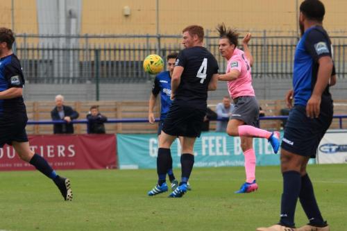 Enfields Sam Youngs (pink) heads for goal