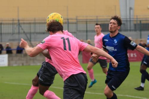 Enfields Taofiq Olomowewe (behind no 11 Aaron Greene) heads just wide