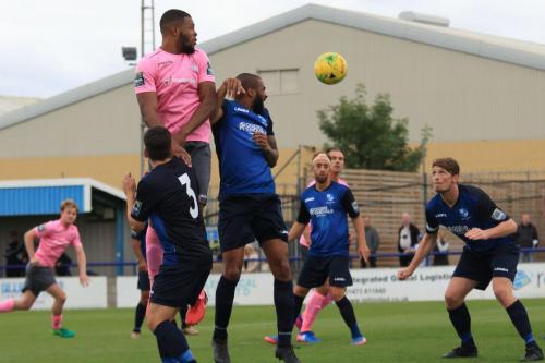 Enfields Taofiq Olomowewe wins a challenge against Layne Eadie (3) and Marc Charles-Smith