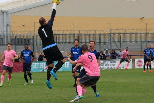 Wingate keeper Shane Gore punches clear