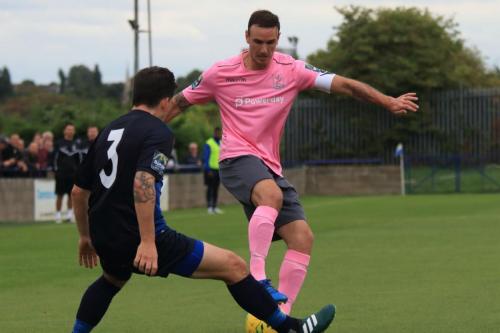 Wingates Layne Eadie (L) and Enfields Matt Johnson