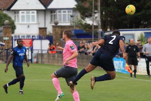 Wingates Luke Ifil (2) clears from Liam Hope