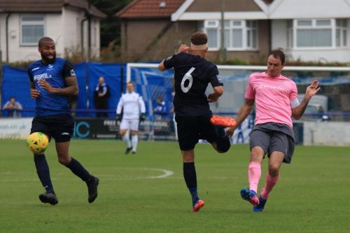 Wingates Marc Charles-Smith (L) and Scott Shulton and Enfields Matt Johnsonx
