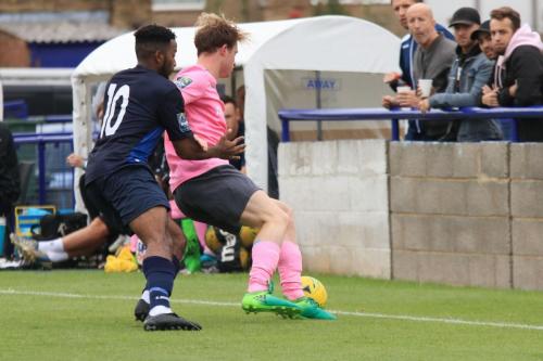 Wingates Reece Beckles-Richards (L) and Enfields Aaron Greene