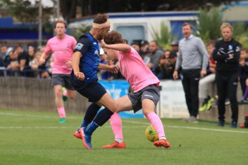 Wingates Scott Shulton (L) and Enfields Sam Chaneyx