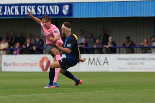 Wingates Scott Shulton blocks a shot from Sam Youngs