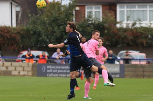 Wingates Sean Cronin (L) and Enfields Liam Hope