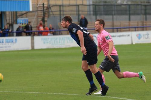 Wingates Sean Cronin (L) and Enfields Liam Hopex