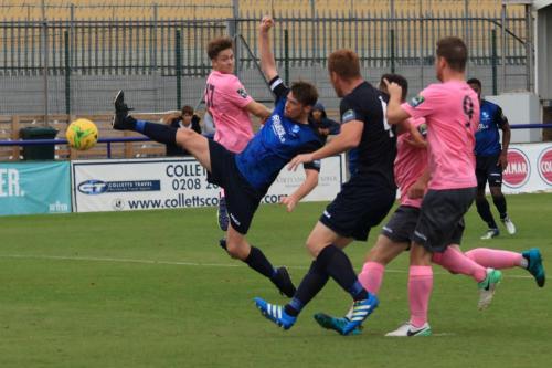 Wingates Sean Cronin stretches for a cross