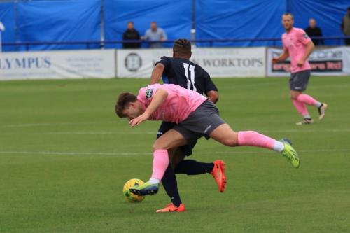 Wingates Tommy Tejan-Sie (blue) and Enfields Lewis Taaffe