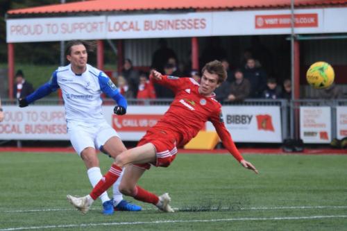 Enfields Sam Youngs shoots as Joe Clarke tries to block