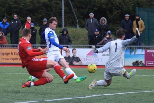 Worthing keeper Kleton Perntreou saves from Aaron Greene