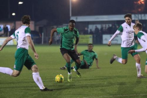 Bognors Keaton Wood (L) clears from Ken Charles