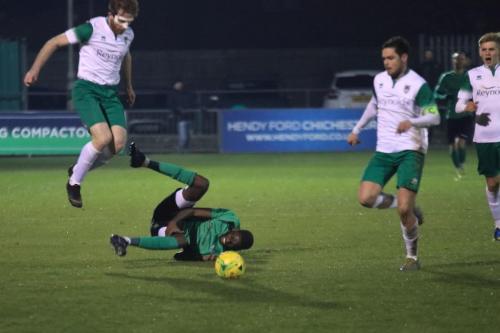 Bognors Keaton Wood (L) received a yellow card for this challenge on Muhammadu Faal