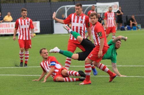 Enfields Billy Bricknell (green) appeals in vain after being tackled by Martyn Stokes