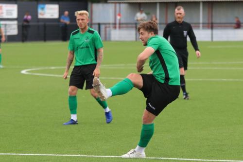 Enfields Lewis Taaffe (R) shoots watched by Ryan Blackman