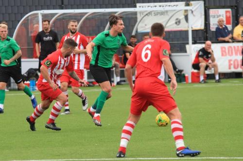 Enfields Sam Youngs (green) shadowed by Ben Sartain (red, L)