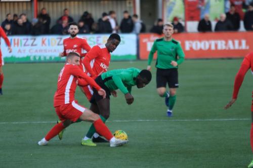 Enfields Junior Mubiayi (green) is fouled by Ernold Haxhiu (L) and or Kershaney Samuels