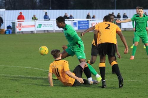 Cheshunts Jamie Reynols (11) and Ibrahim Diallo and Enfields Ken Charles