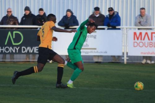 Cheshunts Mo Camara (L) and Enfields Ken Charles