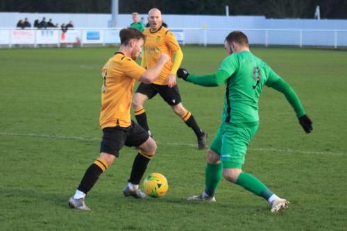 Enfields Billy Bricknell and Cheshunts Jamie Reynolds (L) and Tommie Hession-Harris