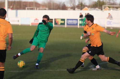 Enfields Sam Youngs (green) and Cheshunts Sean Cronin