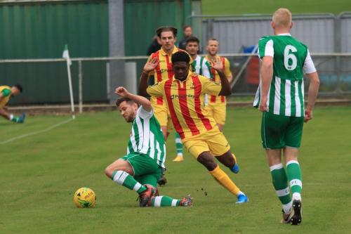 Chichesters Matt Axell (L) wins a challenge against Charles Brown