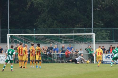 Enfield keeper Nathan McDonald saves a free kick from Josh Clack (out of shot)