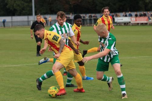 Enfields Alex Read (L)  challenged by Corey Heath (R) and Rob Hutchings