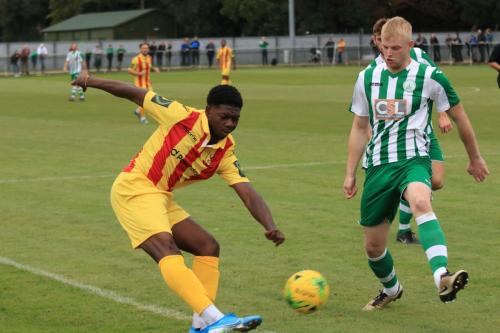 Enfields Charles Brown crosses as Corey Heath tries to block
