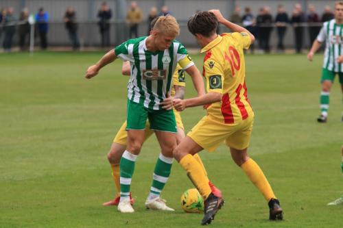 Enfields Sam Youngs (L) challenges Connor Cody